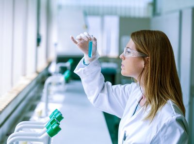 Scientist looking at test tube in the laboratory at the university